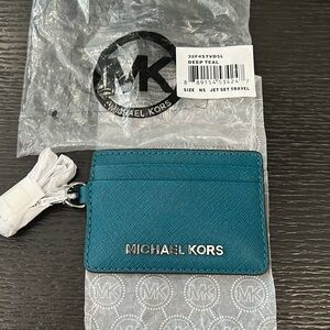 New with tags deep teal Michael Kors leather chain card case.